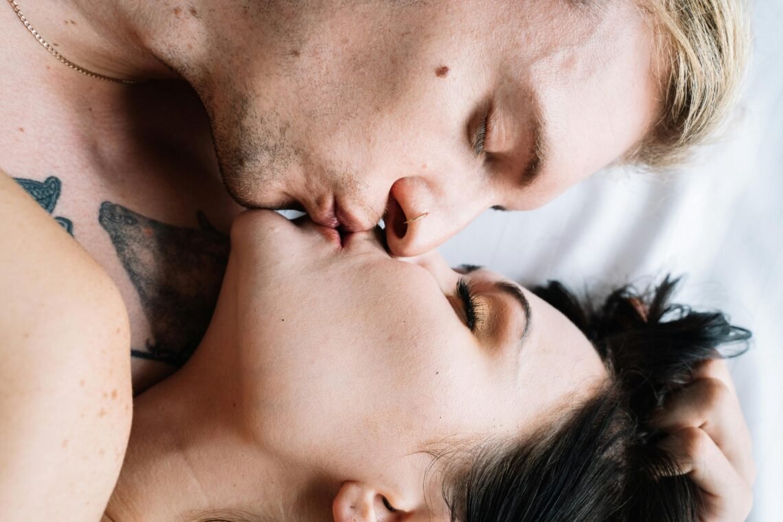 Couple Kissing while Lying