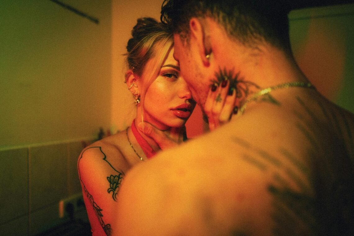 Naked Couple Holding Each Other by Throat