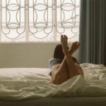 Woman Lying on Bed